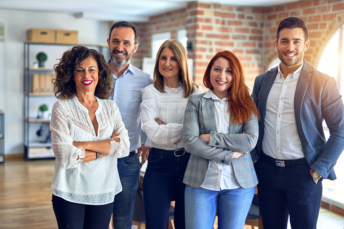 Group of business workers smiling happy and confident. Posing together with smile on face looking at the camera at the office